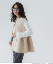 Firm pearl button peplum vest