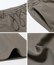 Men's embossed elastic casual pants
