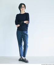 Simple long-sleeved knitted top with gold cuffs