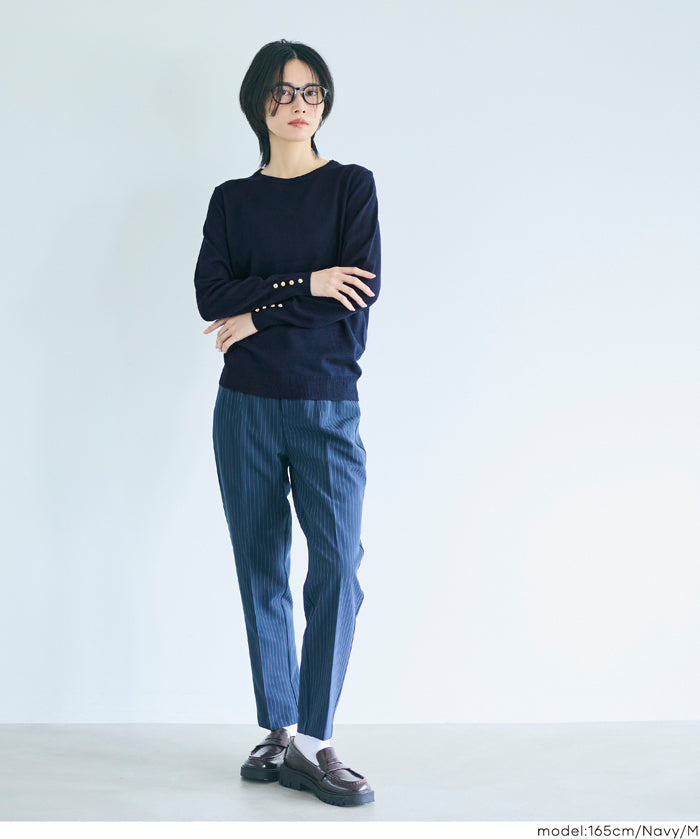 Simple long-sleeved knitted top with gold cuffs