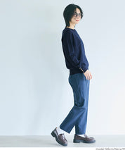 Simple long-sleeved knitted top with gold cuffs