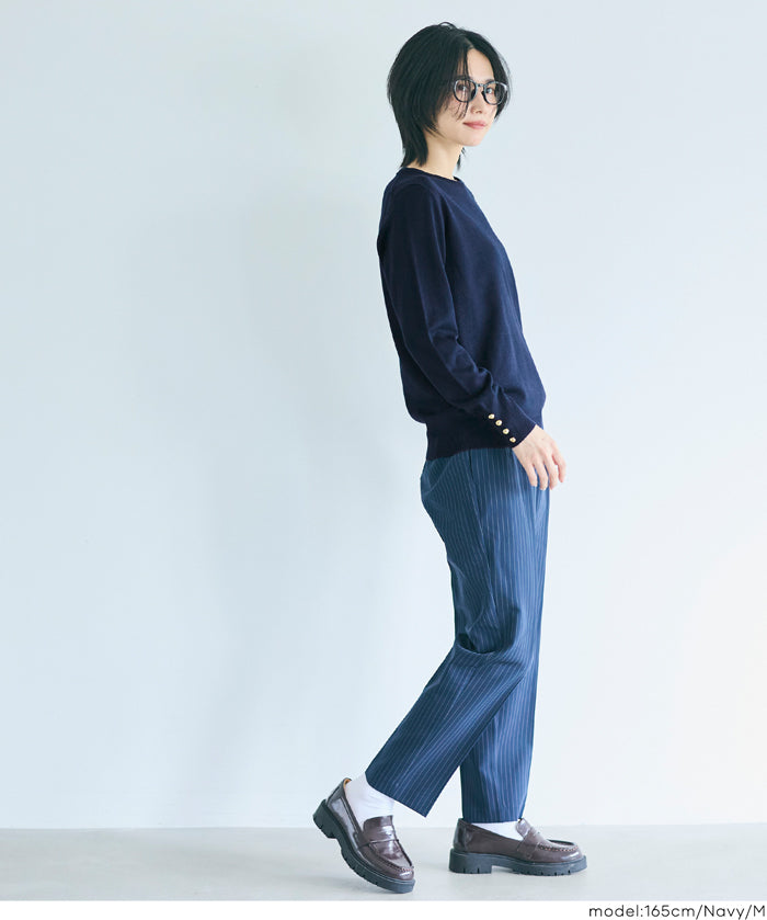 Simple long-sleeved knitted top with gold cuffs