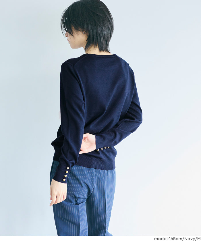 Simple long-sleeved knitted top with gold cuffs