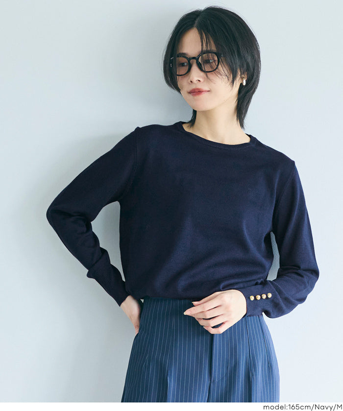 Simple long-sleeved knitted top with gold cuffs