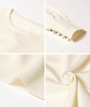 Simple long-sleeved knitted top with gold cuffs