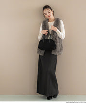 Simple long-sleeved knitted top with gold cuffs