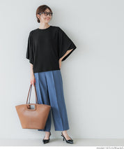 Loose-fitting top with draped sleeves