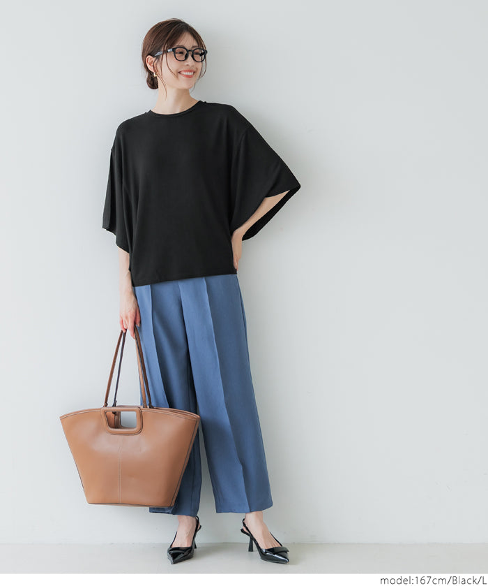 Loose-fitting top with draped sleeves