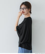 Loose-fitting top with draped sleeves