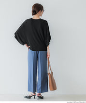 Loose-fitting top with draped sleeves
