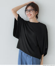Loose-fitting top with draped sleeves