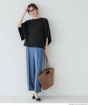 Loose-fitting top with draped sleeves