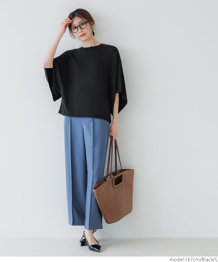 Loose-fitting top with draped sleeves