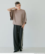 Loose-fitting top with draped sleeves