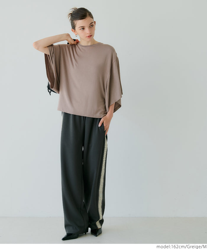 Loose-fitting top with draped sleeves