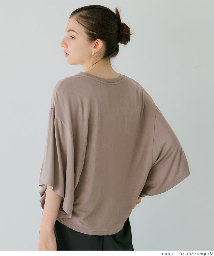 Loose-fitting top with draped sleeves