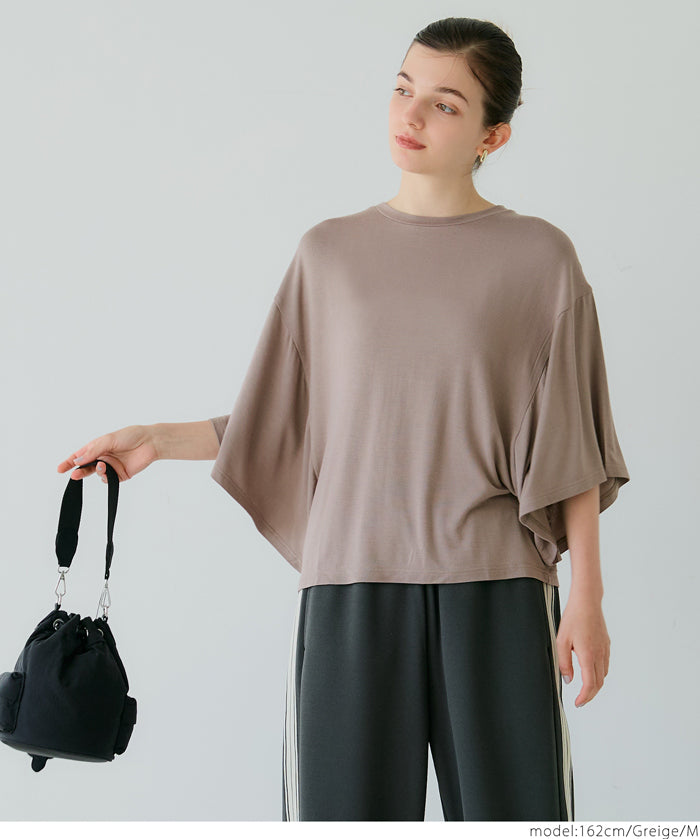 Loose-fitting top with draped sleeves