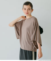Loose-fitting top with draped sleeves