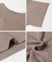 Loose-fitting top with draped sleeves