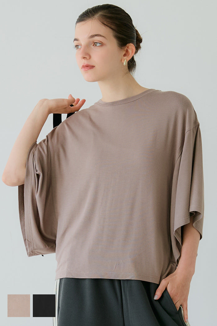 Loose-fitting top with draped sleeves