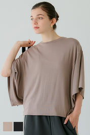 Loose-fitting top with draped sleeves